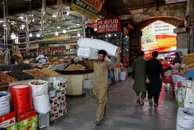 Small retail shops in a Pakistani commercial market.