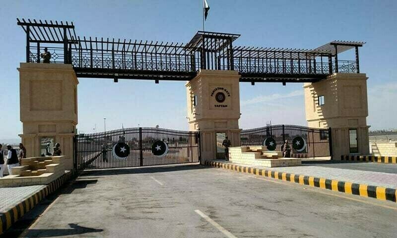 Freight vehicles stopped along the Pakistan-Iran border corridor